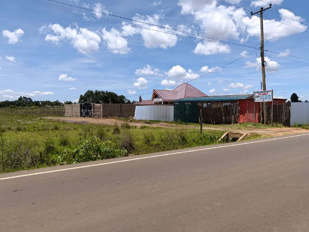Roadside frontage of the Marura (Koshyn) plots with a for-sale sign, Eldoret